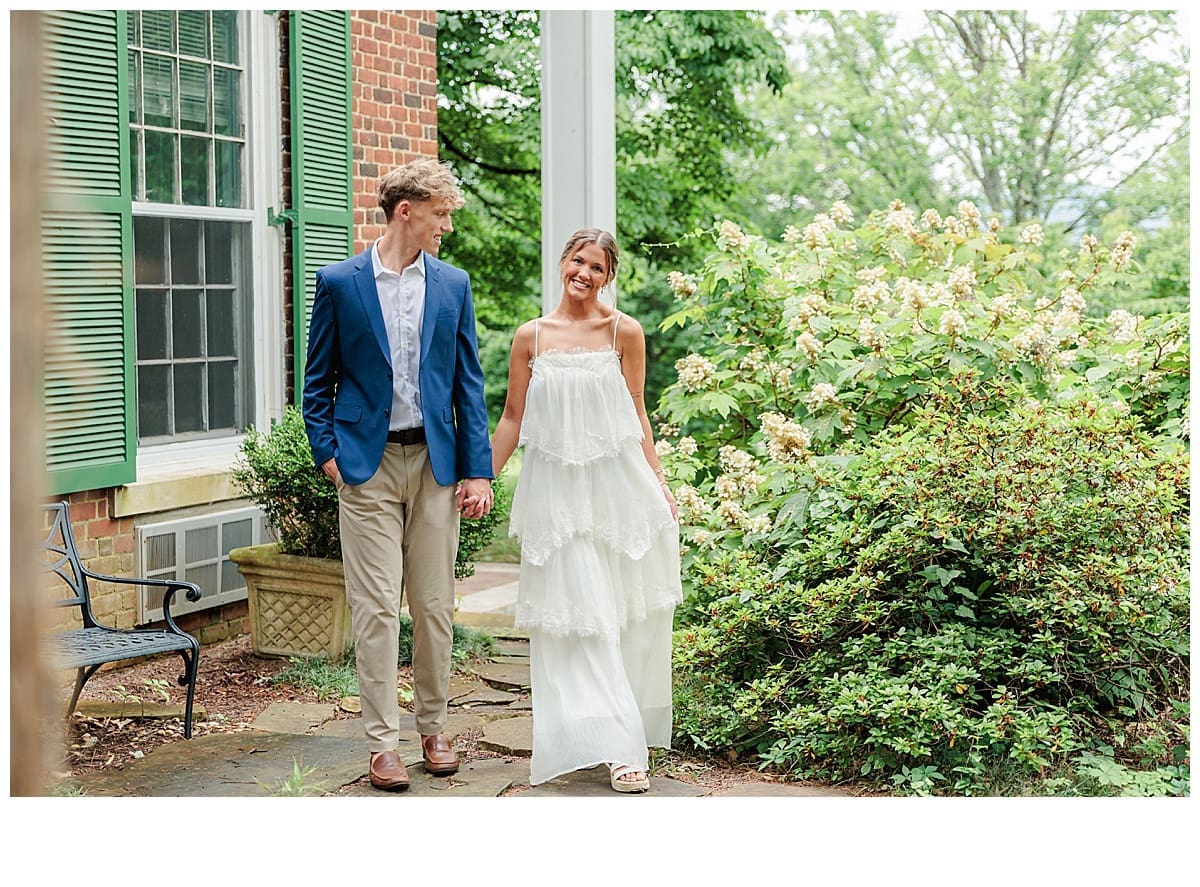 sweet engaged couple walking hand in hand