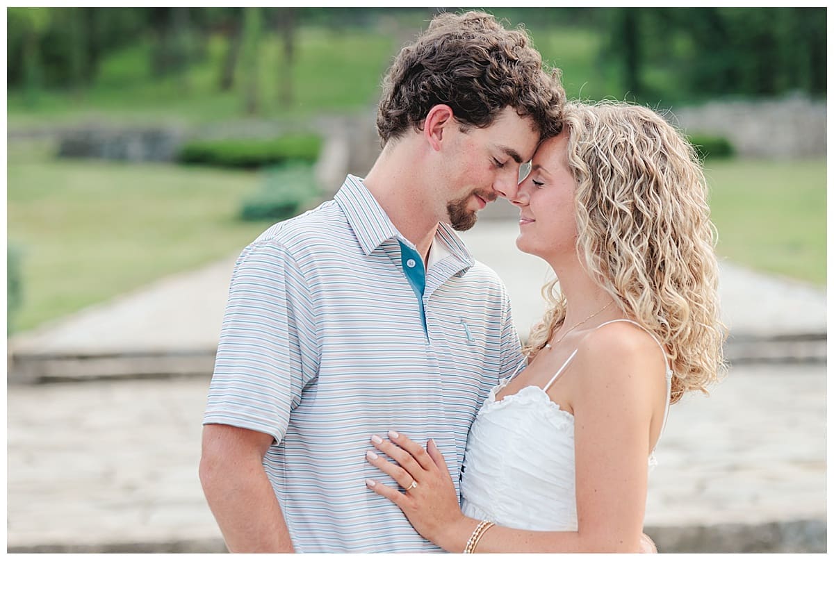 Engaged couple sharing a forehead-to-forehead moment during their Percy Warner Park engagement session.