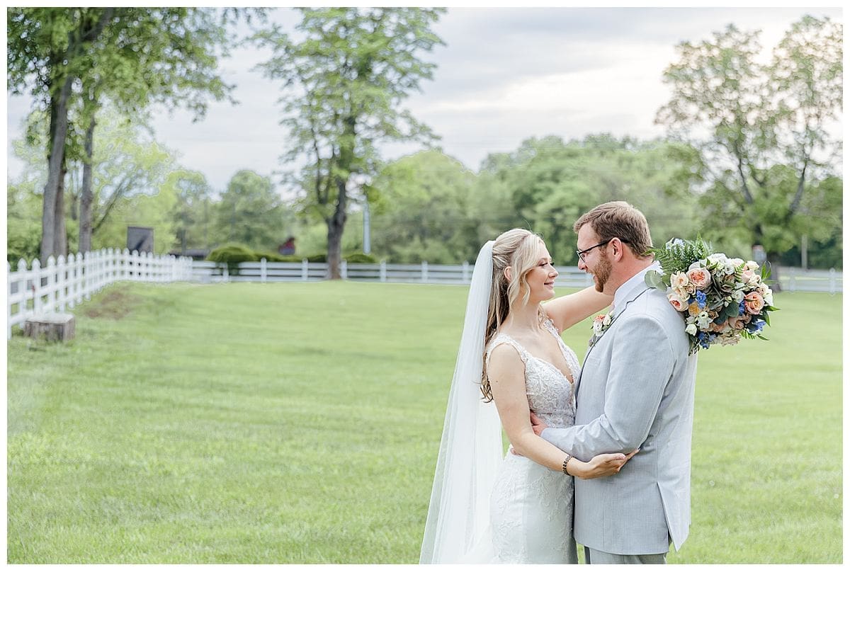 Bride and groom in a beautiful field for wedding portraits