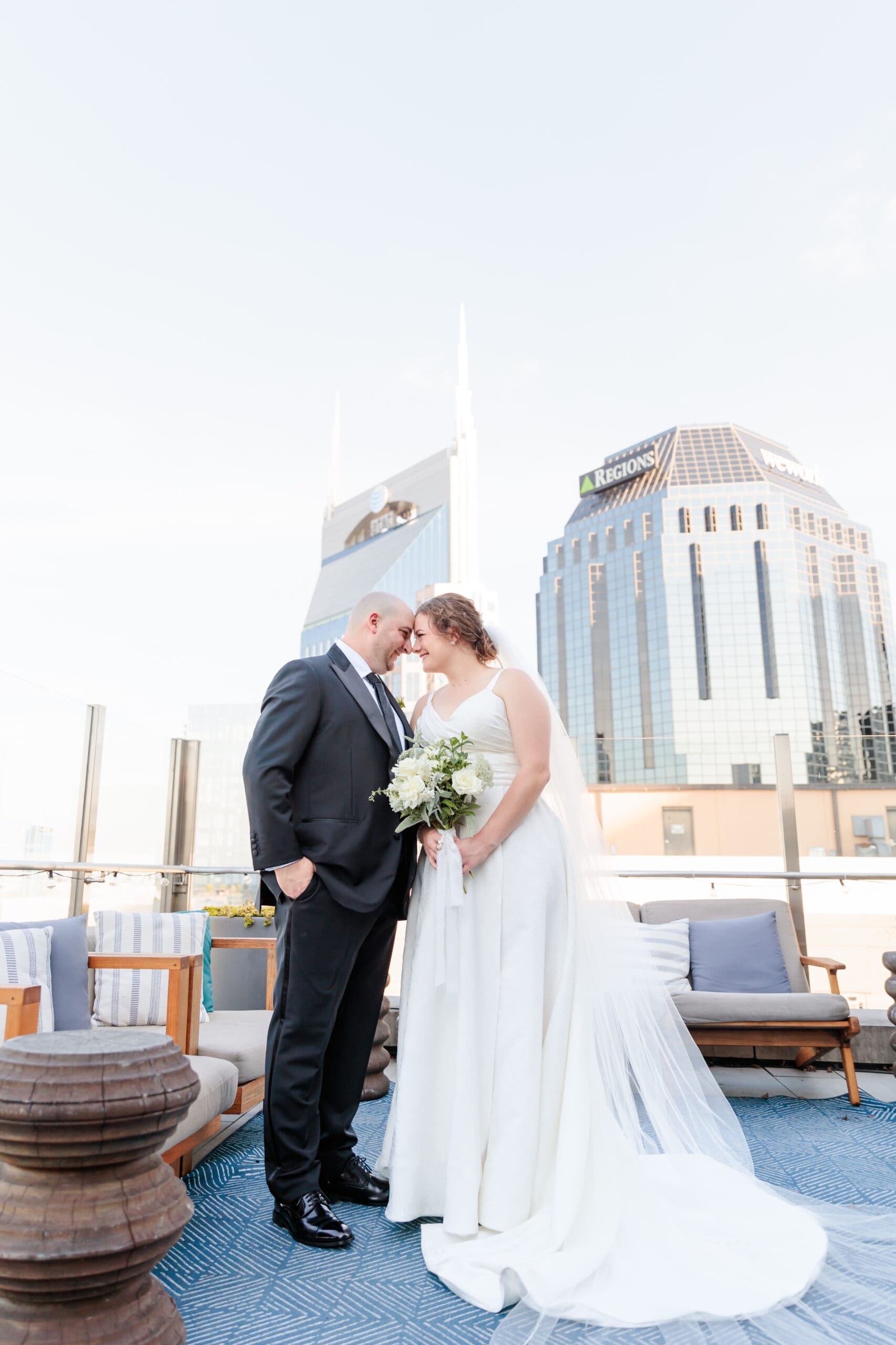 bride and groom portraits on rooftop of the Noelle Hotel in downtown Nashville