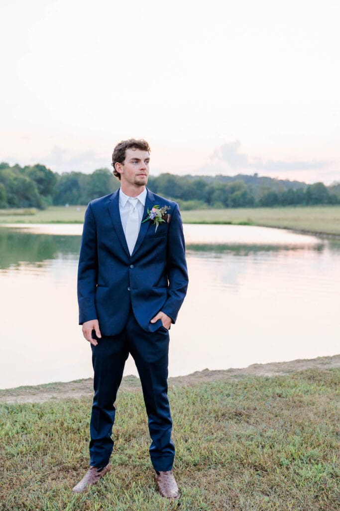 groom portraits in front of the pound.