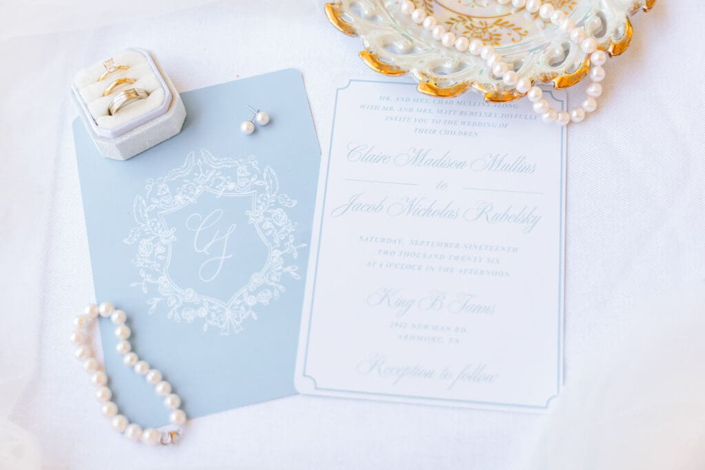 Claire's light blue wedding details and flatlay.