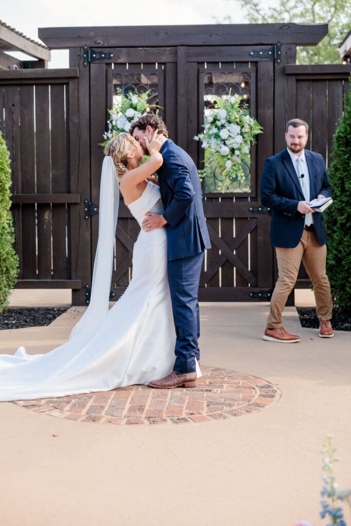 Jake and Claire kissing during their wedding ceremony.