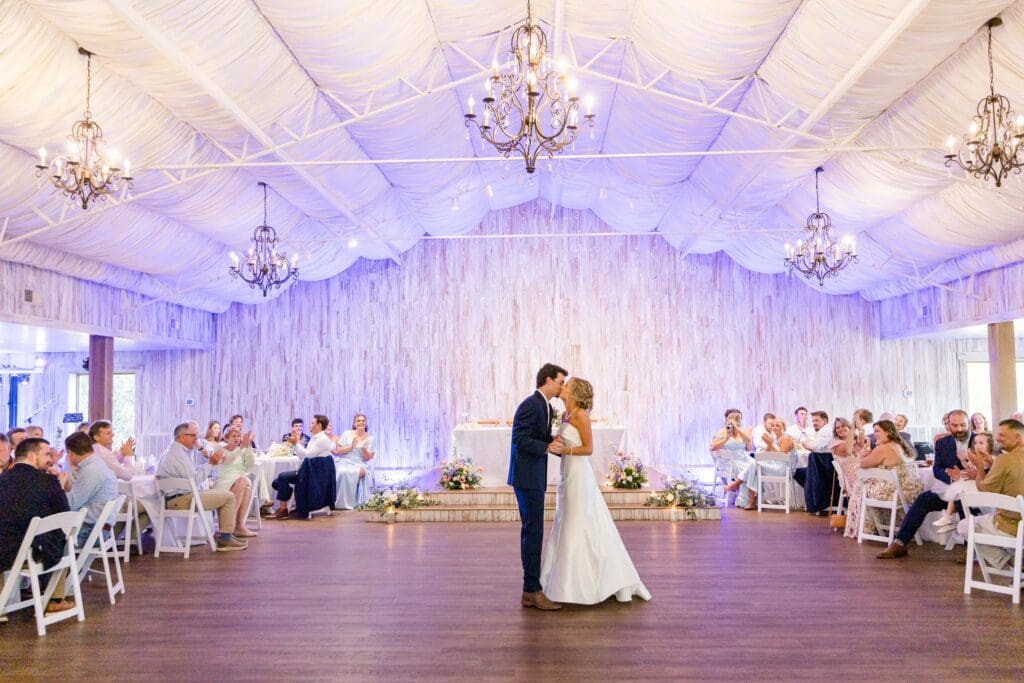 a wide shot of Claire and Jake sharing a first dance.