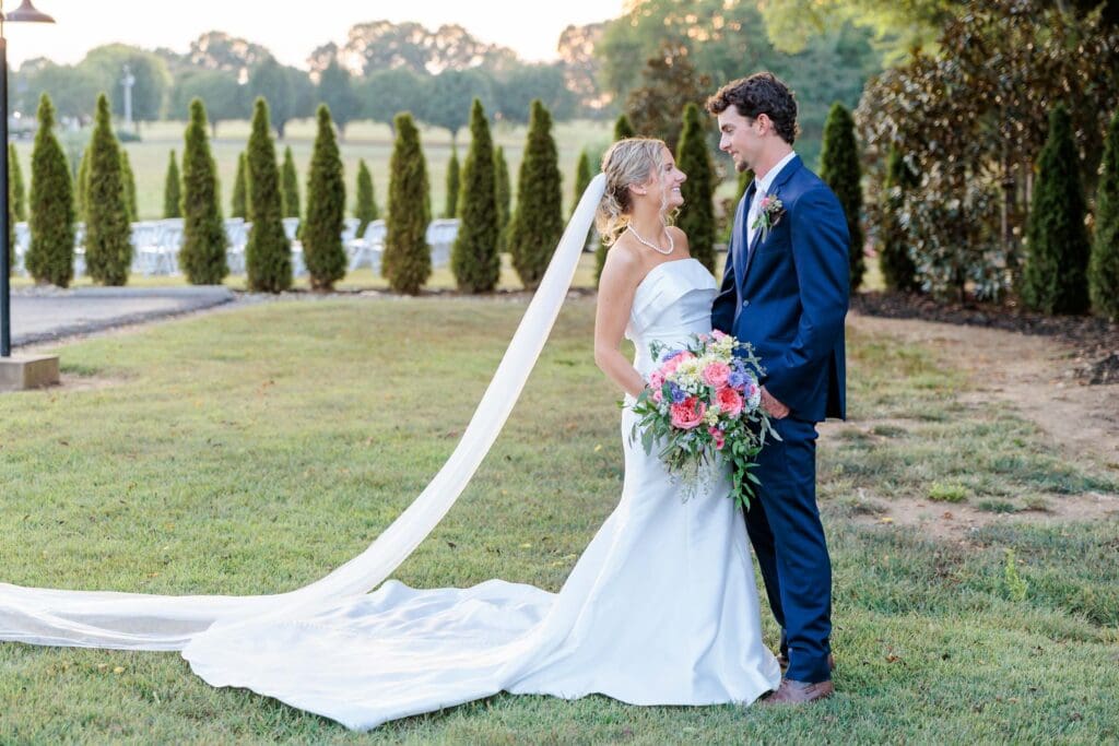 Bride and groom in golden hour light looking to each others eyes.