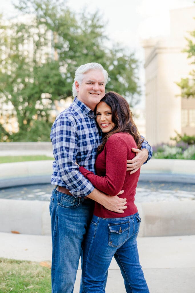 Engaged couple embracing during their Downtown Nashville photo session