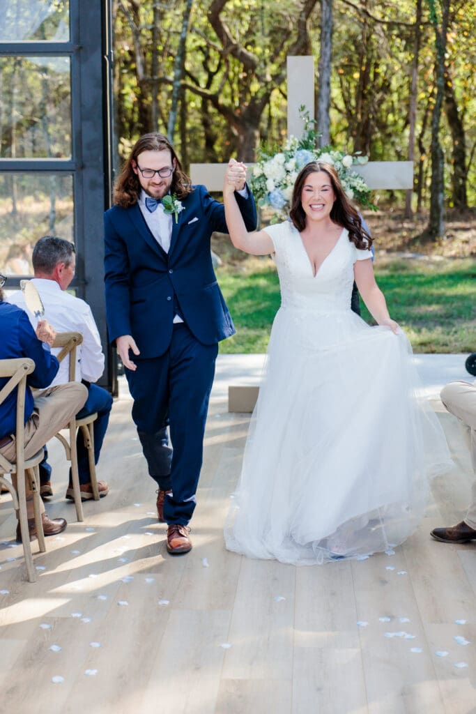 Bride and groom celebrating just married at Jubilee Woods