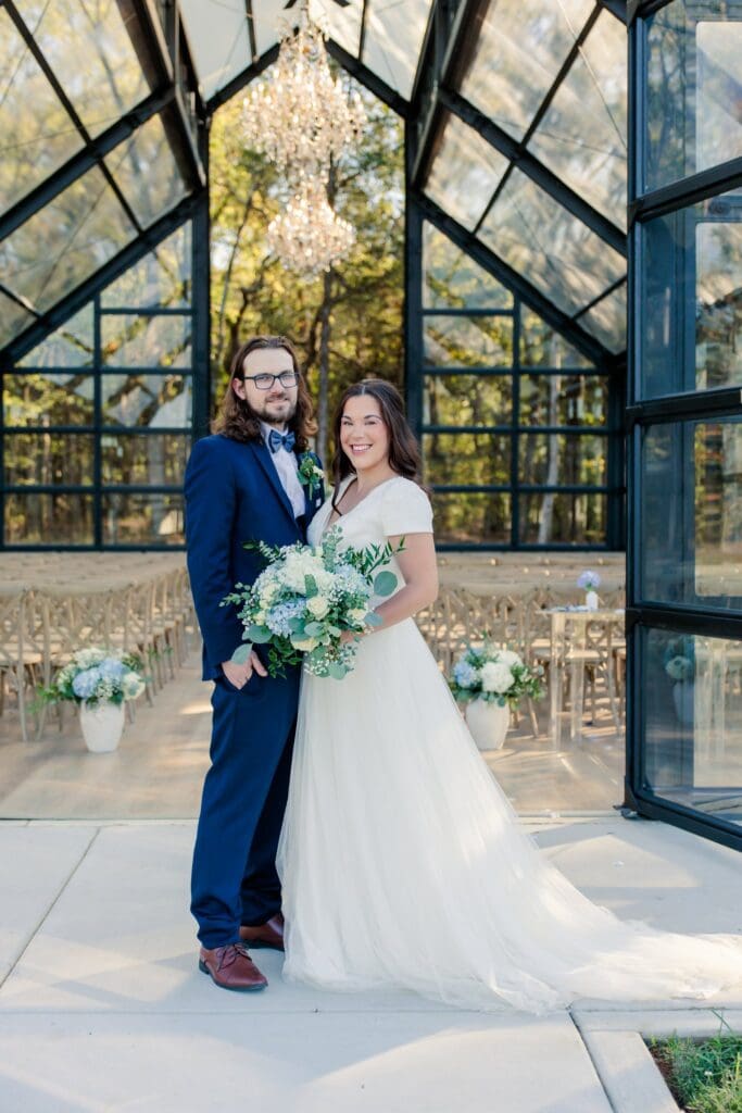 Bride and groom posing for photos at Jubilee Woods wedding venue