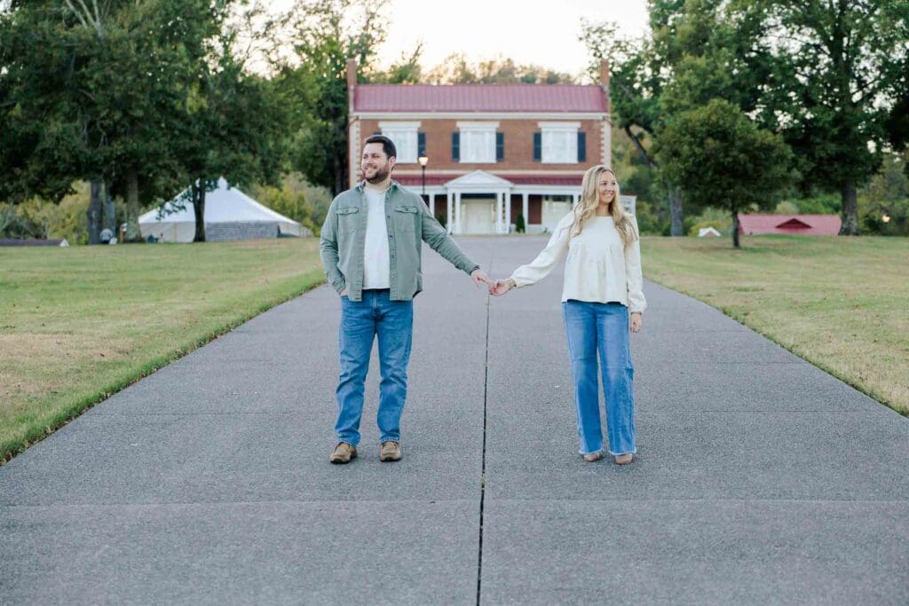 Carly and Lex at Ravenswood Mansion holding hands for their engagement session.