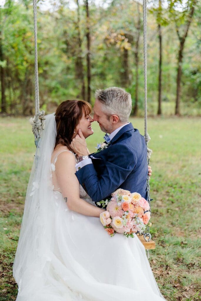 Bride and groom in tree swing at Iriswoods in Mt. Juliet, TN