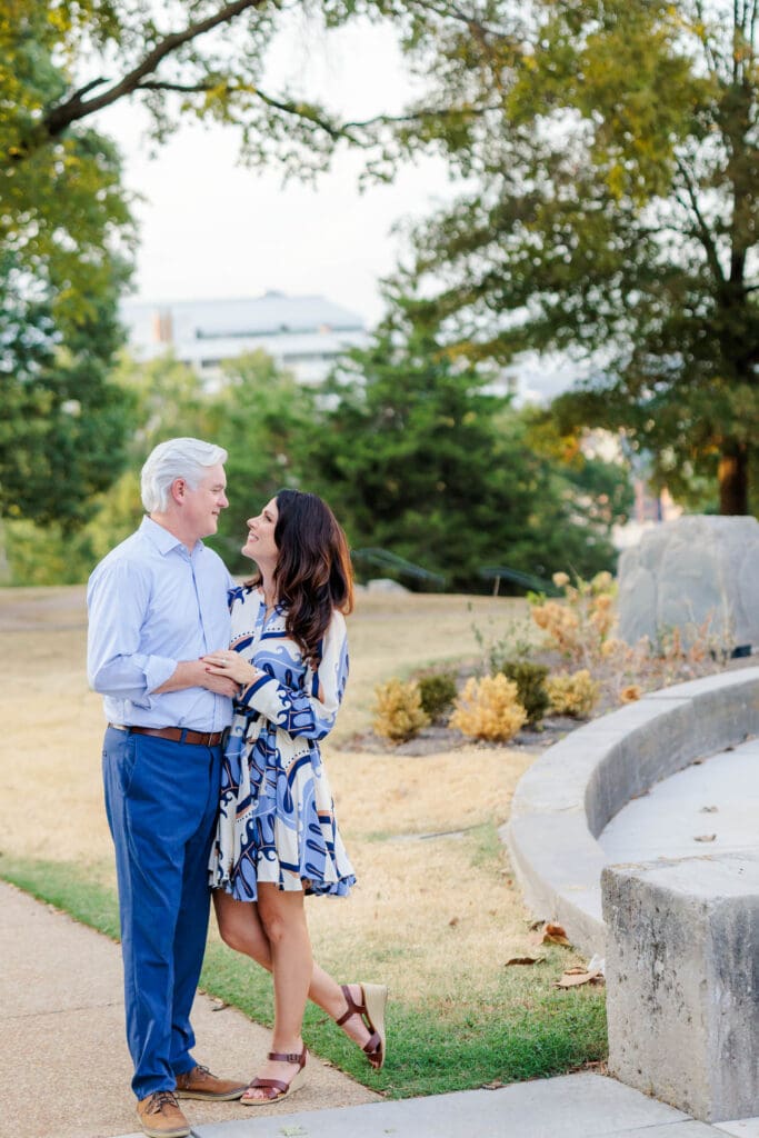 Engaged couple sharing a sweet moment in a Nashville park