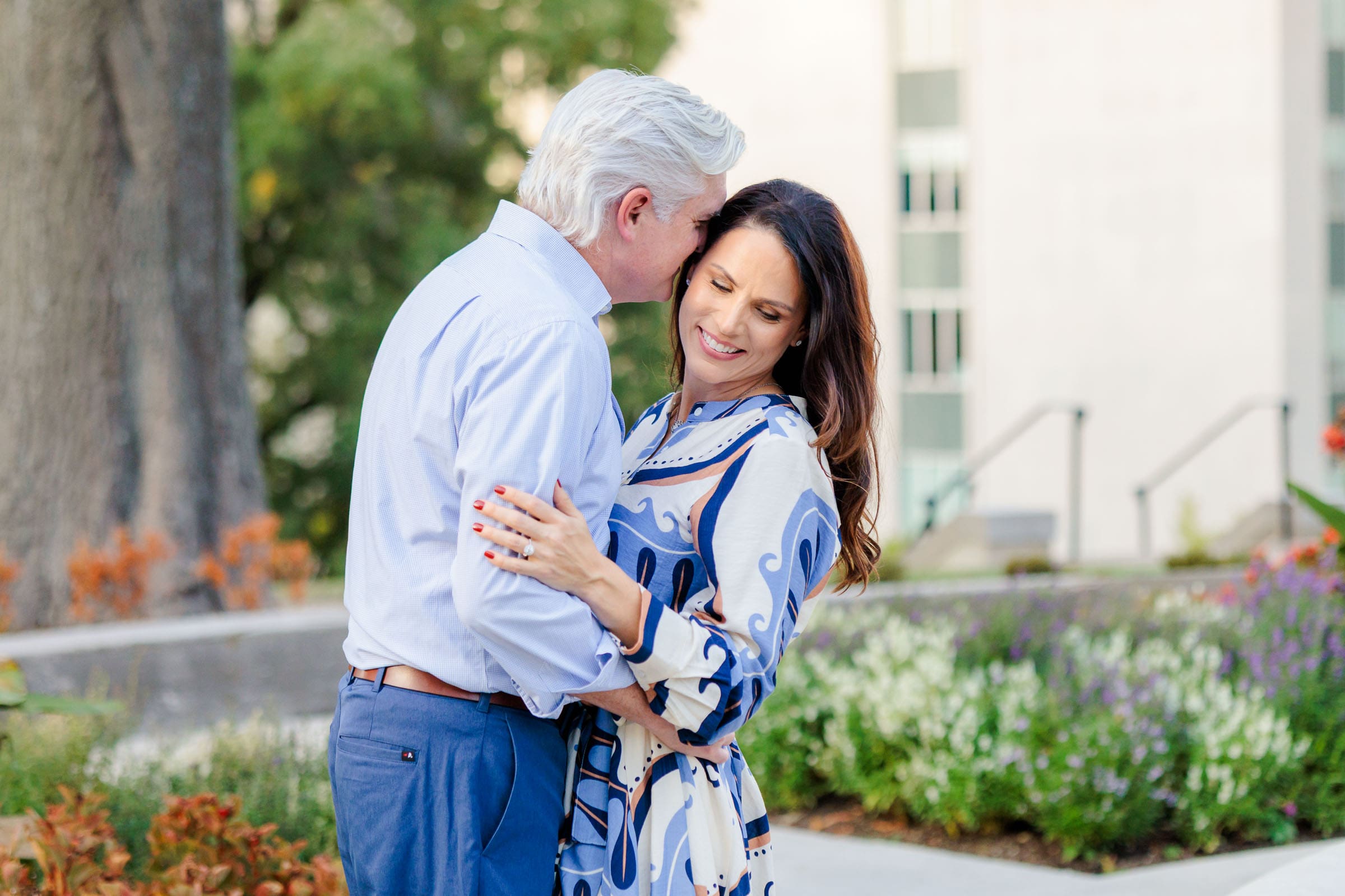 Engaged couple enjoying a romantic moment in Downtown Nashville