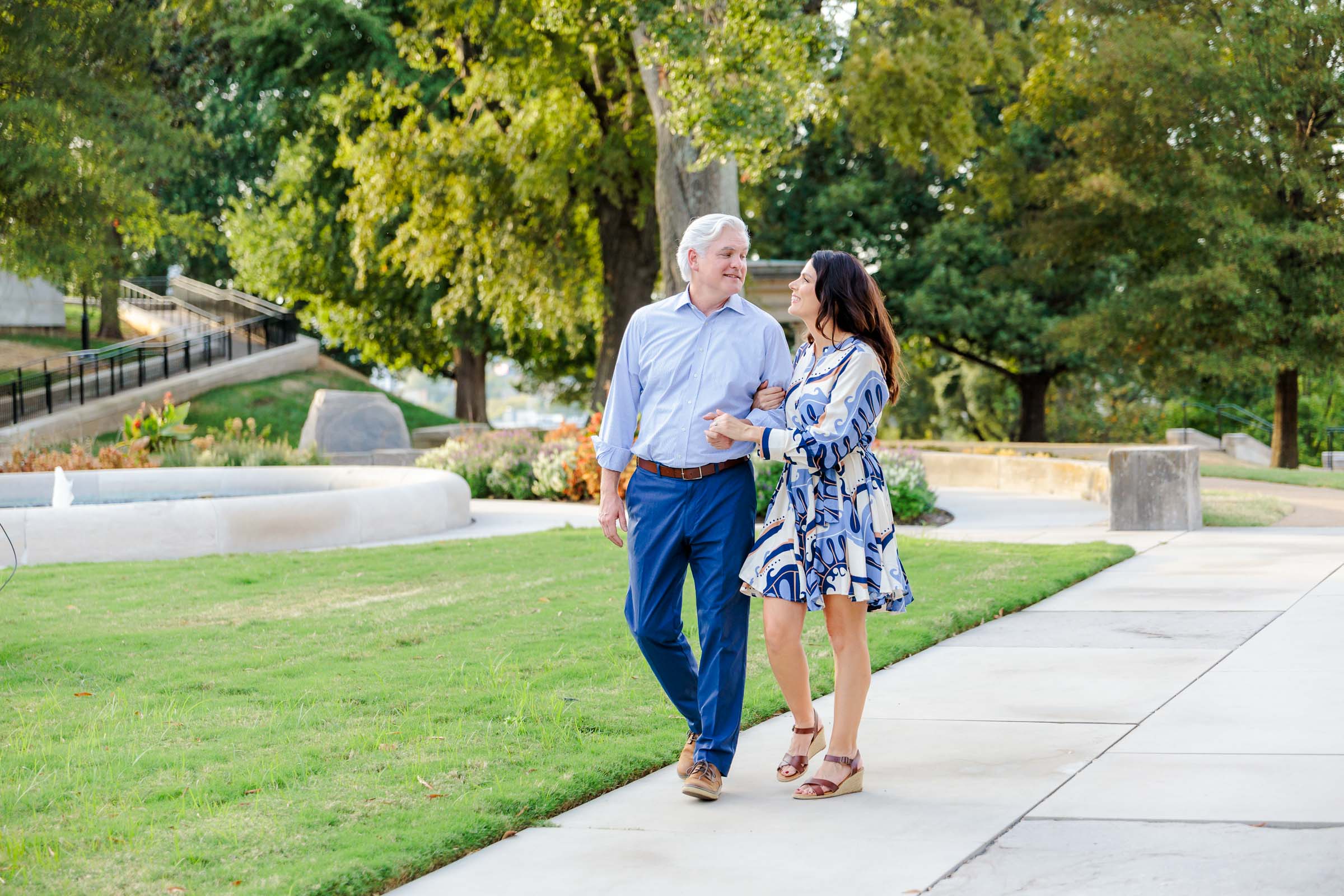 Sarah and Michael walking beneath the trees in Downtown Nashville