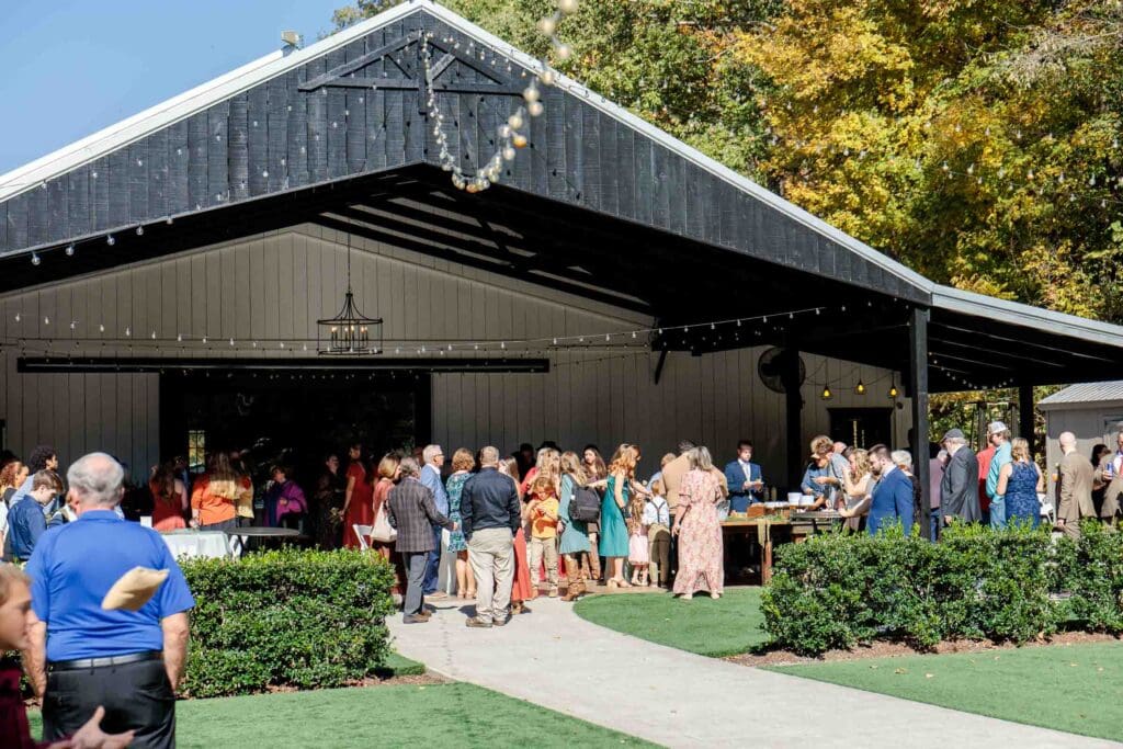 Wedding guests enjoying cocktail hour at The Barn at Firefly Lane in Dickson, TN