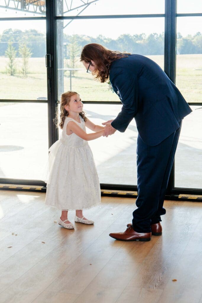 Groom sharing a special dance with his daughter on his wedding day