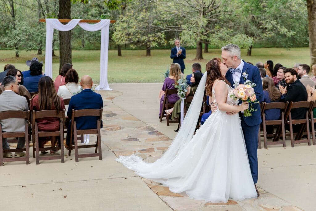 Bride and groom just married kiss at Iriswooods in Mt. Juliet, TN