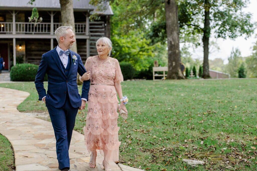 Groom escorting mother down the aisle at Iriswoods wedding venue in Mt. Juliet, Tennessee