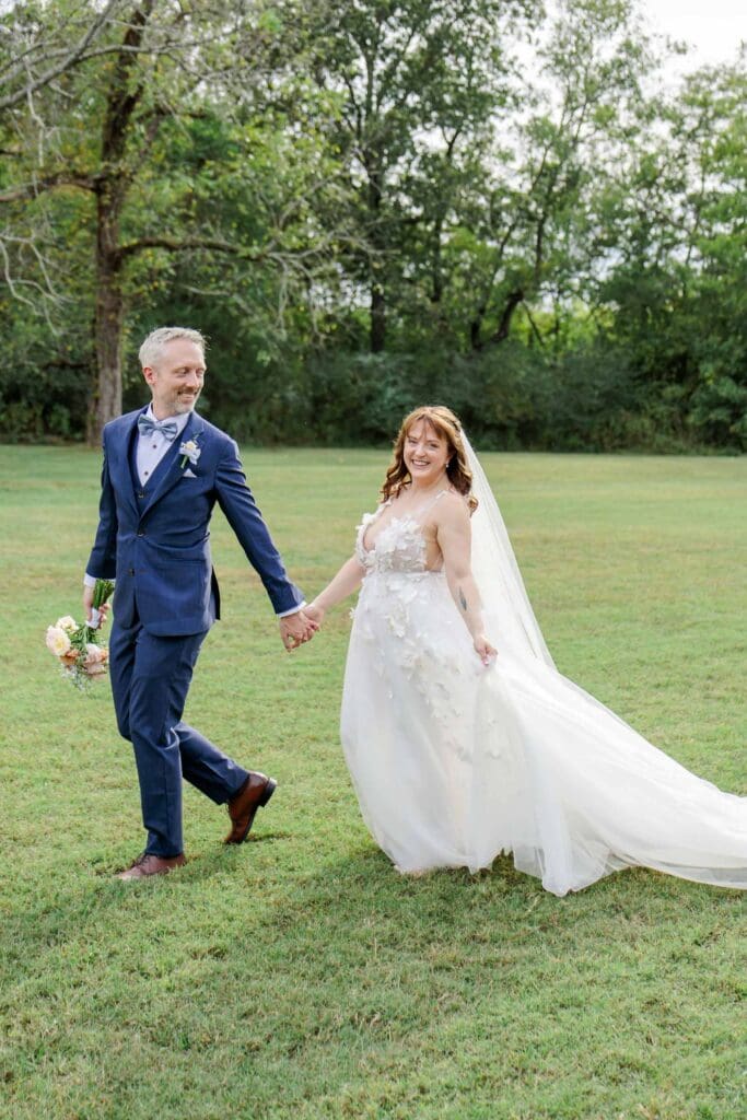 Groom and bride walking outdoors at Iriswoods wedding venue near Nashvillle