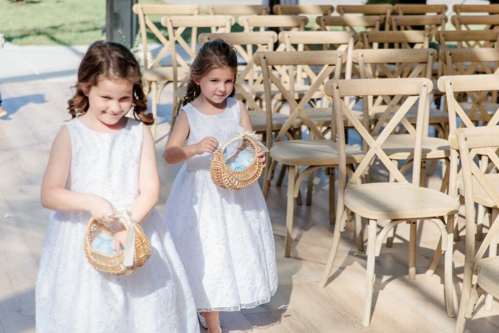 Flower girls inside the glass chapel at Jubilee Woods