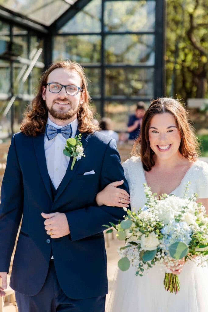 Bride and groom smiling after their Jubilee Woods wedding
