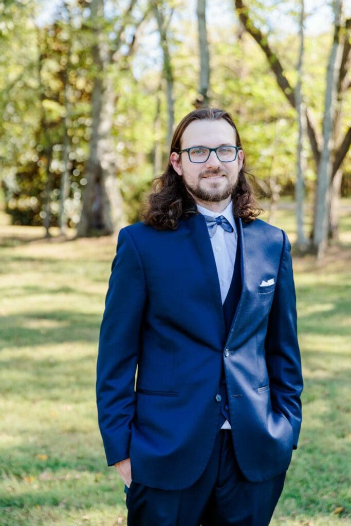 Portraits of Groom Logan before the ceremony