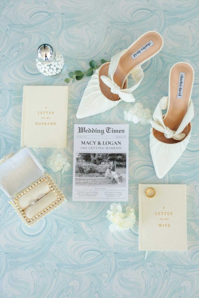 Wedding details in white, light blue, dark blue, and gold at Jubilee Woods