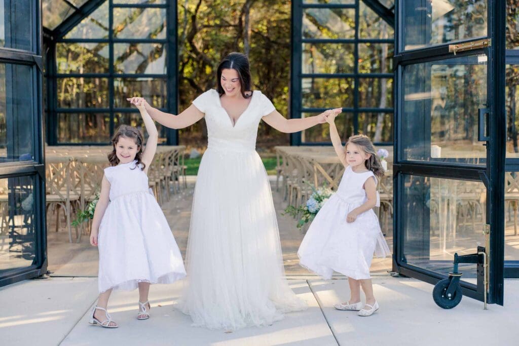 Macy sharing a special family moment with their daughters after the ceremony