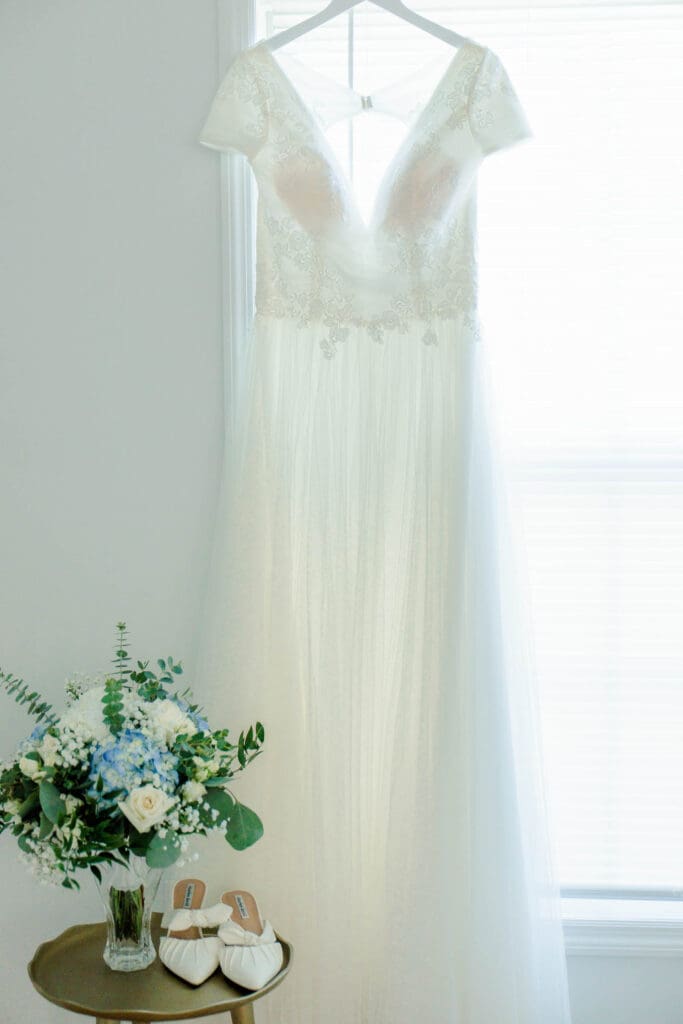 Bride’s wedding dress featuring her favorite flowers, light blue hydrangeas