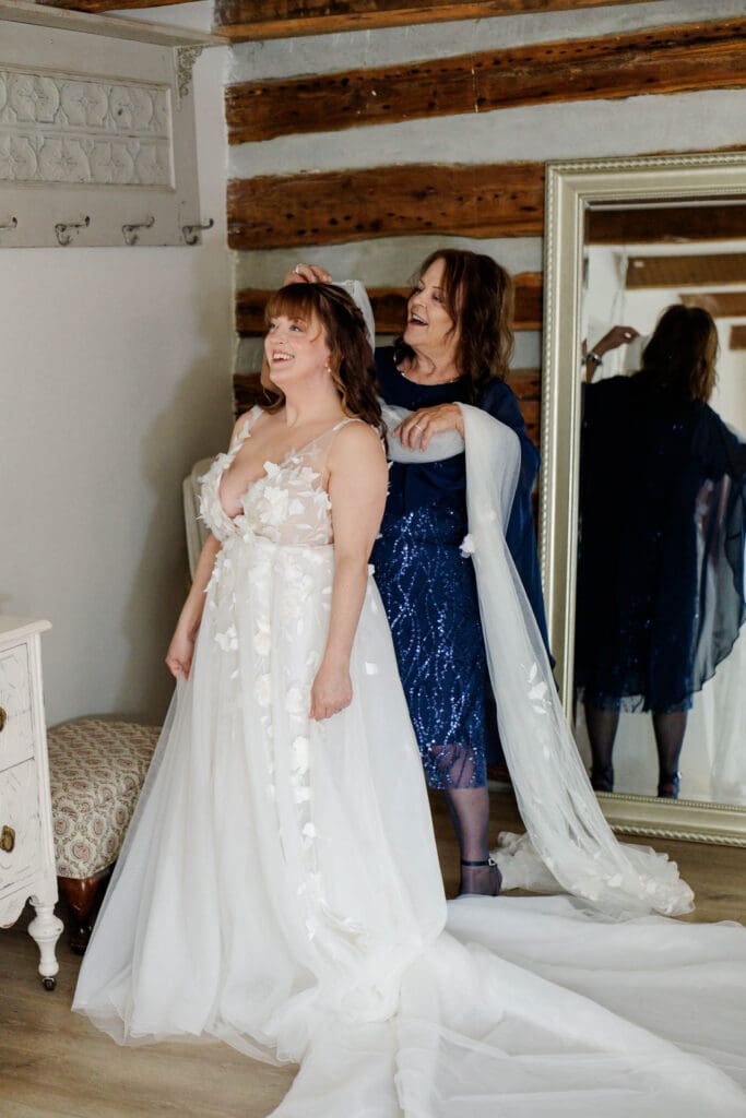 Mother of the bride helping with veil at Iriswoods wedding venue in Mt. Juliet, Tennessee