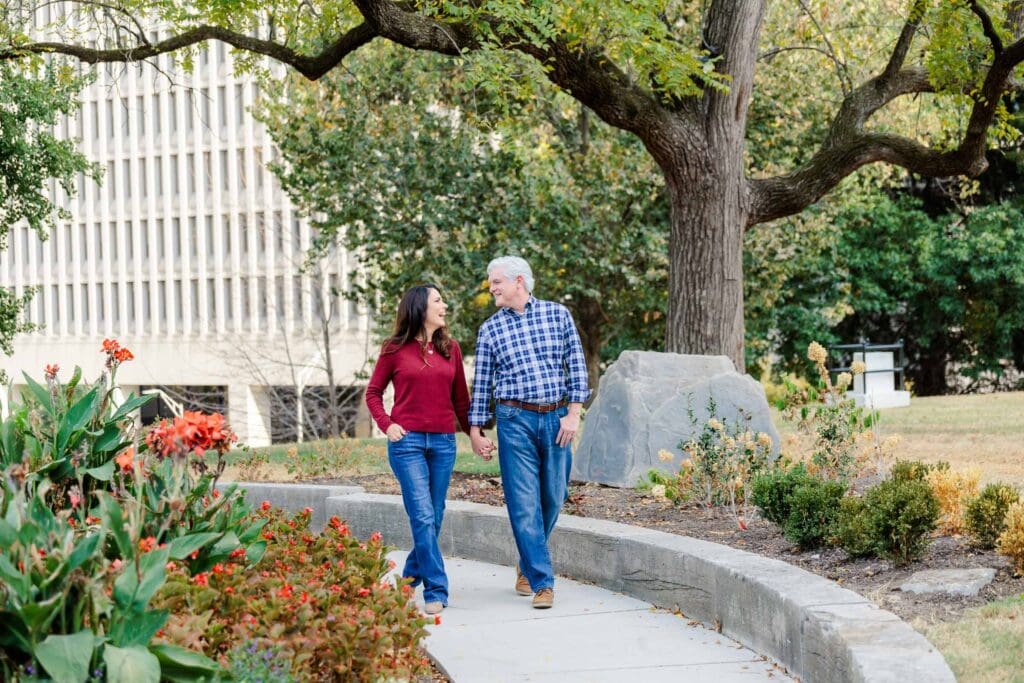 Engaged couple walking together through Downtown Nashville