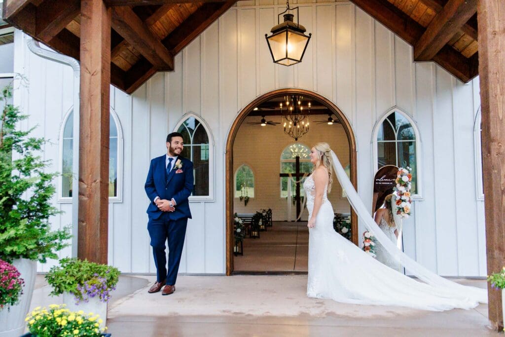 Bride and groom first look at chapel at Paradise Ranch in Springfield, Tennessee.