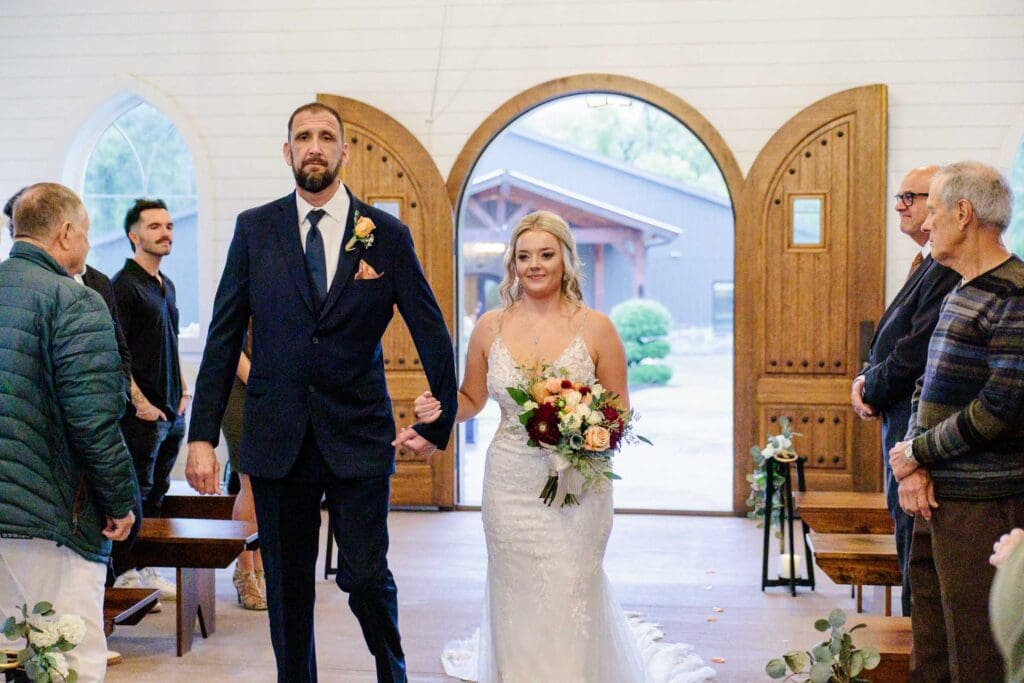 Bride walking down aisle with dad in chapel at Paradise Ranch in Springfield, Tennessee.