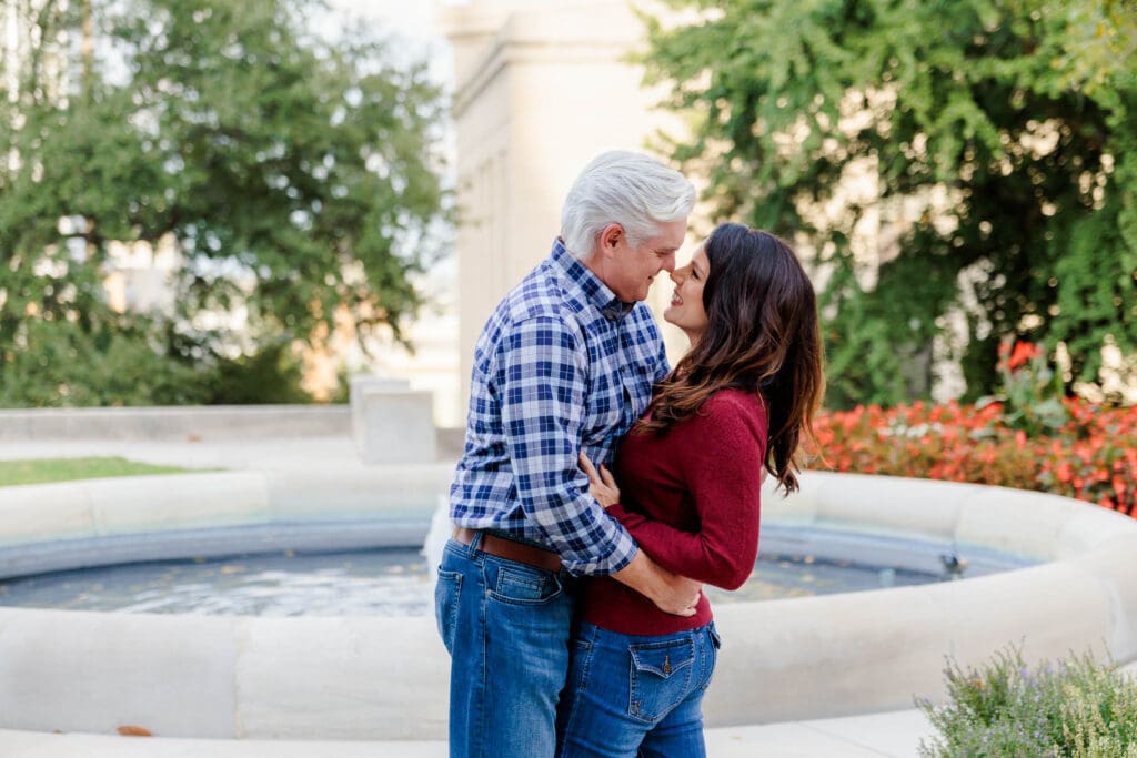 Engaged couple together along a Downtown Nashville sidewalk