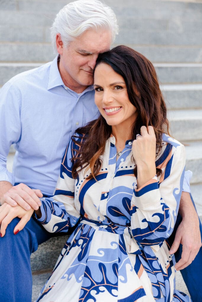 Sarah and Michael sitting together on the steps in Downtown Nashville