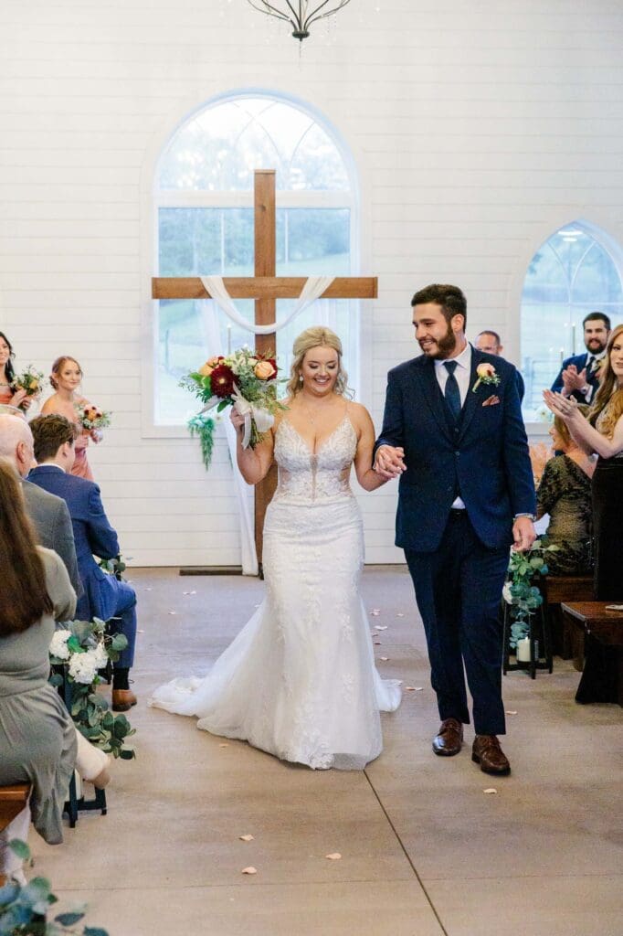 Bride and groom just married in the White Chapel at Paradise Ranch and retreat venue